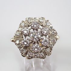 an antique diamond cluster ring on display