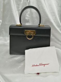 #ad Find ideas�and inspiration for Salvatore Ferragamo 2WAY Handbag Black 9.4 inch Women's, bags Designer Briefcase With Detachable Handle, Designer Flap Bag With Handles For Evening, Designer Travel Flap Bag With Top Carry Handle, Designer Formal Shoulder Bag, Rectangular Satchel With Gold-tone Hardware For Shopping, Designer Satchel Bag For Formal Occasions, Designer Satchel Briefcase With Detachable Handle, Designer Black Handheld Box Bag, Designer Business Flap Bag With Top Carry Handle