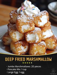 a pile of doughnuts sitting on top of a white plate