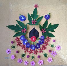 the paper flowers and leaves are arranged in a circle