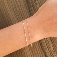 This is a set of layering bracelets inspired by our Shoreline and Shoreline Toggle Necklace. These bracelets look stunning when layered together but also when each bracelet is worn individually or with other bracelets to complete your fabulous look. Made out of high quality gold filled materials and perfect for everyday wear. One set of two chain bracelets: Spring ring clasp (6mm) 14K gold filled chain 1" extender option available Nickel-free Layering Bracelets, Gold Bracelet Set, Toggle Necklace, Chain Bracelets, Gold Ribbons, Solid Gold Jewelry, Layered Bracelets, Gold Filled Jewelry, Necklace Sizes