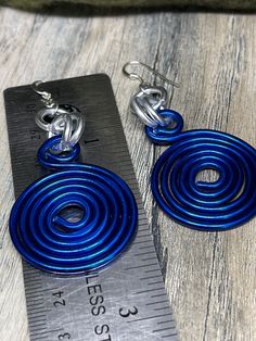 Earrings in Blue and Silver Round Circles inspired by the Zeta Phi Beta colors. Aluminum wire jewelry made by me with Love! I create fun handcrafted jewelry from anodized aluminum and sterling silver. Items are ready to ship, made to order and can be custom made to order. * Handmade Please note the picture is zoomed close to show the detail of the item *Items are handcrafted which means colors, sizes, shapes and designs may vary *Ready to ship items will be the item pictured *Made to order items Aluminum Wire Jewelry, Wire Jewelry Making, Abstract Earrings, Silver Items, Zeta Phi Beta, Anodized Aluminum, Wire Earrings, Circle Earrings, Gorgeous Earrings