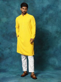 VM By VASTRAMAY Men's Yellow Rayon Schiffli Kurta And Pant Set Experience the vibrant charm of traditional Indian fashion with this yellow rayon kurta and pant set by VM from VASTRAMAY. Crafted with intricate Schiffli embroidery, this set exudes elegance and sophistication, perfect for any festive occasion or cultural event. Features Intricate Schiffli embroidery Comfortable rayon fabric Stylish and traditional design Perfect for festive occasions Specifications Color: Yellow Material: Rayon Siz Yellow Cotton Kurta With Dabka Detail, Yellow Cotton Kurta With Dabka, Yellow Cotton Kurta With Dabka Embroidery, Yellow Cotton Traditional Wear For Eid, Yellow Bollywood Cotton Kurta, Festive Yellow Cotton Kurta, Yellow Cotton Traditional Wear Straight Kurta, Yellow Cotton Straight Kurta Traditional Wear, Yellow Straight Kurta For Festivals