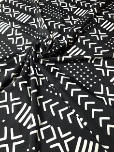 a black and white fabric with geometric designs