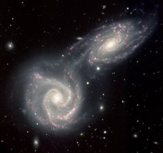 two spiral galaxy like objects in the sky