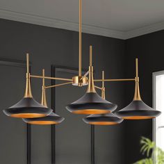 Elevate your home décor with our stunning black and gold chandelier. This contemporary piece is perfect for your kitchen or dining room, adding a touch of sophistication and elegance to any space. With a matte black finish and gold accents, this chandelier is a modern twist on a classic design. The 5 light fixture provides ample lighting for any room. Crafted with high-quality materials, this chandelier is durable and long-lasting. Easy to install, this piece will be the perfect addition to your Modern Gold And Black Chandelier, Dining Room Lights From Lowes, Modern Farmhouse Chandelier Dining Rooms Brass, Black Gold Kitchen Lights, Round Chandelier Dining Room Black, Black Chandelier Table, Statement Black Chandelier, Black And Brass Kitchen Chandelier, Modern Chandelier Black Huge