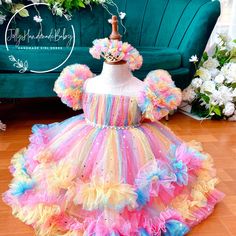 ♥ This beautiful rainbow tulle girl dress is the perfect birthday gift for your daughter. The dress features three colorful ruffles and puffy sleeves, making it a very cute and stylish design that any little girl will love. It can also be a great gift for a baby or a baptism dress. As an added bonus, you will receive a free headband or turban in the same color, along with high-quality customer service. We ensure fast and safe shipping, so you can have the dress in no time. ♥ The dress is made wi Rainbow Tulle Dress, Gown Birthday, Girls Tulle Dress, Dress Baby Girl, Girls Tutu Dresses, Girl Tutu, Birthday Party Outfits, Dressup Party