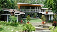 the house is surrounded by trees and plants