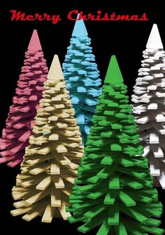 three different colored christmas trees with the words merry christmas