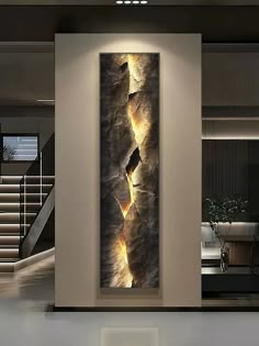 an abstract painting on the wall in a modern living room with stairs leading up to it