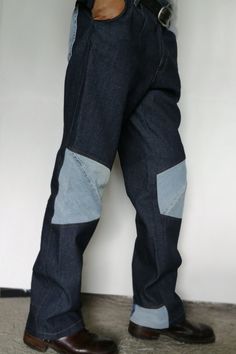 "The pair of Fancy and Reworked Cargo Straight Leg Jeans (Waist 38) you'll never want to take off! Cool Handmade Patched Dark Denim Pants, Mens Patchwork Jeans from Exclusive Denim Cotton and with Two Front Pockets. The Recycled Two Knee Jean Patches make this High Waist Boot Cut Jeans stand out from the Rest. Backside is Embellished with Two Reused Jeans Pockets.  Measurements: *Circular measurements  Waist:     94 Centimeters - 38 Inches* Hip:        112 Centimeters -44 Inches* Length: 110 Cen Blue Rigid Denim Pants With Contrast Stitching, Denim Blue Recycled Denim Patchwork Pants, Recycled Denim Patchwork Pants In Denim Blue, Denim Blue Patchwork Pants In Recycled Denim, Patchwork Recycled Denim Pants In Denim Blue, Fitted Blue Jeans With Patch Pockets, Blue Rigid Denim Bottoms With Contrast Stitching, Reworked Recycled Denim Blue Bottoms, Reworked Blue Recycled Denim Bottoms