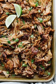 shredded pork with cilantro and lime in a casserole dish, ready to be eaten