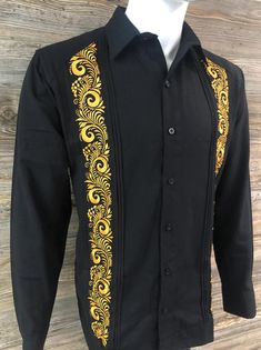 Authentic Mexican Guayabera.  Beautiful and Elegant Shirt  Handcrafted in Merida, Yucatan Mexico. Black Color Fabric - Cotton Polyester Blend Beautiful and Elegant Gold Embroidery - Palm Leaf Design Two Embroidery Panels Long Sleeve.  Good for Casual and Formal Wear, Wedding, Fiesta, Tropical, Birthday or any other occasion. 100% New Product - New Inventory 2024 We gladly accept returns and exchanges with these terms and conditions.  We do charge a 25% Fee on any returns. This helps compensate for shipping fees, packing supplies and labor costs.  Exchanges have no cost.  Customer is responsible for shipping items back.  We do not provide prepaid labels.  Items should be returned just as received and with no damages or signs of wear. Thank You Guayabera Wedding, Wedding Fiesta, Merida Yucatan Mexico, Palm Leaf Design, Wedding Shirt, Shirt Elegant, Fiesta Tropical, Tropical Birthday, Yucatan Mexico