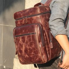 lang1:  Make a statement with this classic timeless backpack. Make with soft leather, available in two colours. Size approximately:  11" x 7.5" x 16.5" (28cm x 19cm x 42cm) Multiple pockets Laptop space Adjustable Straps lang2:  Gwnewch argraff hefo'r bag cefn clasurol hwn, wedi ei wneud o ledr meddal, ar gael mewn dau liw.  Maint: 11" x 7.5" x 16.5" (28cm x 19cm x 42cm) Pocedi niferus Strapiau addasadwy Travel Bagpack, Mobile Telephone, Handmade Leather Backpack, Rucksack Bag, Pack Bag, Backpack Fashion, Leather Rucksack, Hot Style, Laptop Rucksack