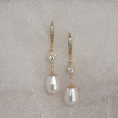 "* Beautiful gold wire wrapped Swarovski Pear Pearl dangle earring accented with a gold-filled bead cap and complimented a cubic zirconia center piece bead and hung from a cubic zirconia ear wire. This pair of earrings measure approximately 1 3/8\". * Also, available in Swarovski Pearls ~ White (shown), Cream (shown), Cream Rose, Light Gold, and Rose Gold. * Matching bracelet (shown in the 5th picture)~ https://www.etsy.com/listing/783225489/wedding-jewelry-for-brides-swarovski * TAKE 10% OFF $7 Gold Dangle Teardrop Earrings For Bridesmaid Gift, Gold Wire Wrapped Crystal Earrings For Wedding, Delicate Gold Crystal Earrings With Pearl Drop, Wedding Crystal Dangle Earrings Wire Wrapped, Wedding Crystal Drop Earrings Wire Wrapped, Elegant Gold Wire Wrapped Teardrop Earrings, Gold Elegant Crystal Earrings For Bridesmaid, Gold Pearl Drop Earrings For Mother Of The Bride, Wedding Wire Wrapped Crystal Drop Earrings