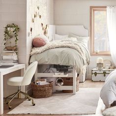 a bedroom with a bed, desk and chair