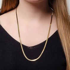 This vintage necklace (circa 1980-1990) features a chain of 14k gold herringbone links. The piece measures 24 inches long and weighs 8.4 grams. It is in great condition. Materials: 14k gold. Classic Herringbone Necklace With Box Chain For Formal Occasions, Classic Gold Herringbone Necklace With Snake Chain, Classic Yellow Gold Snake Chain Necklace, Gold Herringbone Necklace With Box Chain For Formal Occasions, Classic 14k Gold Snake Chain Necklace, Gold Herringbone Chain Necklace For Formal Occasions, Classic Gold Snake Chain Necklace For Formal Occasions, Yellow Gold Herringbone Necklace For Formal Occasions, Formal Gold Herringbone Chain Necklace