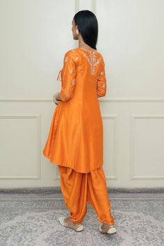 Buy Sheetal Batra Orange Silk Chanderi Angrakha Set Online | Aza Fashions Orange Dola Silk Sets With Resham Embroidery, Designer Slub Silk Sherwani With Traditional Drape, Orange Sets With Resham Embroidery In Traditional Drape, Orange Resham Embroidery Sets For Navratri, Festive Orange Sets With Resham Embroidery, Orange Raw Silk Sets With Zari Work, Orange Embroidered Sharara With Traditional Drape, Orange Embroidered Sharara For Navratri, Orange Designer Wear Sets With Traditional Drape