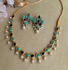 A gorgeous handmade kundan necklace with matching dangle earrings Set includes a necklace and matching earrings. Versatile. Can be paired with any dress. Handmade with highest quality of craftmanship. The Necklace Has adjustable Chain at the back . The Earrings Have Push Backs . Customized orders takes 3 to 4 weeks, depending on piece requirements. Kundan Necklace With Matching Earrings For Diwali Celebration, Kundan Bridal Necklace With Matching Earrings For Celebration, Festival Necklace, Handmade Chokers, Wedding Jewelry Set, Kundan Set, Kundan Necklace, Choker Set, Dress Handmade