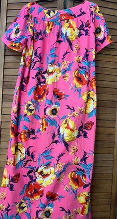 This stylish handcrafted, short sleeve, A-line maxi dress has large, bright blooms scattered across a bright pink background by HibiscusHawaiian on Etsy Traditional Hawaiian Dress, Bright Pink Background, Hawaiian Clothing, A Line Maxi Dress, Hawaiian Outfit, Hawaiian Dress, Pullover Designs, Dress Clothes For Women, Pink Background