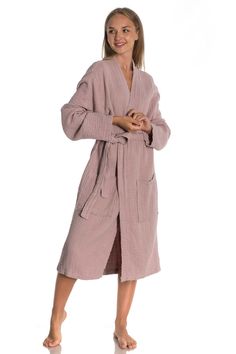 "Introducing the Short Muslin Kimono Bathrobe - the ultimate combination of comfort and style. This unisex robe is made from premium quality muslin fabric that is incredibly soft and lightweight, making it perfect for lounging around the house or slipping into after a refreshing shower. The kimono-style design features a relaxed fit with a wide collar and loose sleeves that provide ample room for easy movement. The robe is generously cut to fit most body types and the adjustable belt ensures a comfortable and customized fit. Crafted with care and attention to detail, this bathrobe is designed to last for years. The muslin fabric is not only durable but also easy to care for - simply toss it in the washing machine and tumble dry low. Whether you're looking for a cozy robe for yourself or a Casual Cotton Robe For Lounging, Casual Cotton Lounging Robe, Casual Cotton Robe For Sleep, Casual Cotton Sleep Robe, Beige Cotton Robe For Daywear, Wedding Day Robes, Kimono Bathrobe, Baby Poncho, Mode Kimono