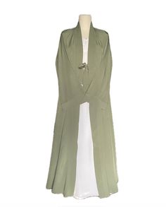 Soft lightweight pastel green long abaya kaftan cape with v-shaped neck, may also be worn as an open abaya. Front open ribbon closure robe/cape/stole with wide curved sleeves and nice flare for a flowy and stylish look and ease of walking. A nice touch to your simple abaya or suit look. Fabric and style suitable for all occasions and weather conditions. Abaya kaftan cape may be worn with any color abaya or salwar or dress suit of your choice. Available in size 54. This item comes as cape ONLY, it does not come with under abaya as shown in images. (You may purchase linen abayas separately of your color choice from the shop to pair with this cape.) Green Long Thobe For Eid, Elegant Green Spring Abaya, Green Long Kaftan For Eid, Green Khimar For Eid, Elegant Green Maxi Kimono, Long Sleeve Green Abaya For Spring, Elegant Green Maxi-length Kimono, Green Long Sleeve Abaya For Spring, Spring Green Long Sleeve Abaya