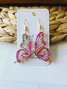 Introducing our Butterfly Acrylic Pink and Orange Swirl Earrings, a true work of art for your ears. Crafted from high-quality acrylic, these earrings feature a beautiful and unique rainbow swirl design resembling the graceful butterfly wings. Add a touch of elegance and sophistication to any outfit with these exquisite earrings. Hypoallergenic hook. Acrylic pattern (varys with each earring) Earrings measure 2" long. CARING FOR YOUR JEWELRY: * Please remove earrings before bathing and swimming. Material: Hypoallergenic Earring Hooks. Nickel-free with anti-allergy can be used for sensitive skin REFUNDS/EXCHANGES We cannot offer exchanges on earrings due to sanitary conditions of wearing in earlobe. If you item is damaged during shipping, we will be happy to replace your item! Please provide Acrylic Pink, Earrings Butterfly, Earrings Hypoallergenic, Swirl Earrings, Rainbow Swirl, Butterfly Wing, Hypoallergenic Earrings, Swirl Design, Earring Hooks