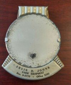 an old silver watch with the date on it