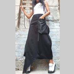 "Asymmetric long black skirt🤩 Extravagant designs and high quality fabrics. The item from the pictures is size S For more information feel free to ask questions. Material &Care Cotton textiles end polyester Hand wash at low temperatures Do not machine dry Do not iron Do not dry clean Sizing We make size from xs to 5xl as well as customized measures.So don't hesitate to contact us and make one for you. 🛫🎁Shipping🎁 🛬 STANDARD SHIPPING Europe : 6-8 business days USA&Canada : 8-10 busin Black Asymmetrical Hem Bottoms For Evening, Asymmetrical Maxi Skirt With Pockets, Black Asymmetrical Wrap Skirt For Summer, Asymmetrical Black Skirt For Evening, Black Asymmetrical Skirt For Evening, Black Asymmetrical Hem Wrap Skirt For Party, Black Asymmetrical Draped Skirt For Summer, Black Asymmetrical Draped Skirt For Spring, Black Draped Skirt With Asymmetrical Hem For Summer