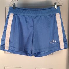 Nwot Nike Women’s Size Large Blue Athletic Shorts, Mesh With White Strips And Logo, Never Worn, 100% Polyester, Inside Tie Front, Nike Blue Sporty Shorts, Blue Sporty Athletic Shorts For Spring, Sporty Blue Athletic Shorts For Spring, Nike Blue Bottoms With Elastic Waistband, Blue Fitted Athletic Shorts For Spring, Fitted Blue Athletic Shorts For Spring, Blue Fitted Casual Athletic Shorts, Nike Stretch Blue Bottoms, Blue Nike Athletic Shorts