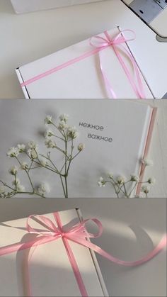 an open white box with pink ribbon and flowers