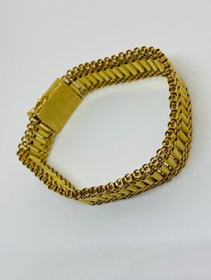 "This is a beautiful, vintage 14K yellow gold bracelet. Material(s) 14K yellow gold Measurements: This bracelet measures 7 inches in length and 14.3 millimeters in width. Weight: 24.6 grams Markings: \"14K\" If you have any questions about this bracelet, please do not hesitate to contact us! ♥" Antique Gold Bracelet Stamped 14k, Antique 14k Stamped Gold Bracelet, Antique Yellow Gold Bracelets For Formal Occasions, Antique Yellow Gold Bracelet For Formal Occasions, Antique Yellow Gold Jubilee Bracelet, Victorian Yellow Gold Bracelet For Formal Occasions, Heirloom Yellow Gold Jubilee Bracelet, Antique 14k Gold Bracelets For Formal Occasions, Antique 14k Gold Formal Bracelets