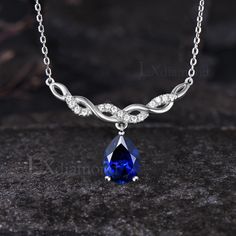 Item description ✦ Handmade, high-quality item! ✦ Material: 925 sterling silver, Solid 14K/18K GOLD (can be made in white/rose/yellow gold), Platinum ✦ Center Stone: 7x9mm Pear Cut Lab Blue Sapphire ✦ Side Stones: Round Cut Moissanites ✦ Chain length can be adjusted between 16 inches and 18 inches As it is handmade, it needs 2-4 weeks to finish and then be shipped by USPS or FedEx. Return policy: We offer 30 days return policy. For any reason, if you are not completely satisfied with your order, you may return it for a refund.  Buyer is responsible for the handcraft fee (15%-30% of the total price) and the return shipping cost. September Birthstone Necklace, Sapphire Side Stones, Blue Sapphire Necklace, Necklace Unique, Rose Yellow, Split Shank, September Birthstone, Sapphire Necklace, Birthstone Necklace