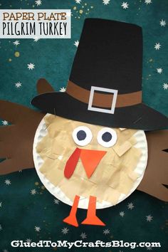 a paper plate turkey with a pilgrim hat on it's head, and stars in the background