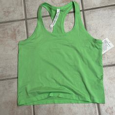 Price Is For A Brand New Lululemon Swiftly Tech Rb Tank 2.0 Race. Brand New, Never Been Worn. Limited Edition - No Longer Available Size 12, $58, Scream Green. All Items Are Authentic, Brand New, Never Been Worn, Unless Otherwise Stated. All Sales Are Final - Please Ask Any Questions Prior To Purchase. Thank You For Looking. Green Tops For Light Sports With Medium Support, Casual Green Seamless Activewear, Green Racerback Tank Top For Light Sports, Green Athleisure Tank Top For Light Sports, Casual Green Activewear For Light Sports, Green Tops For Light Sports, Green Moisture-wicking Tank Top For Light Sports, Green Racerback Breathable Top, Green Tank Top For Light Sports In Summer