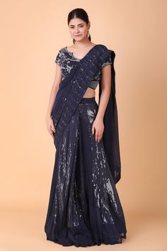 Navy blue pre-draped saree with tonal sequin embroidery. Paired with a blouse with all over floral vine embroidery using sequin, stone. - Aza Fashions Elegant Blue Pre-draped Saree For Navratri, Formal Blue Bollywood Pre-draped Saree, Blue Georgette Pre-draped Saree For Formal Occasions, Formal Pre-draped Saree With Mirror Work, Formal Draped Lehenga For Diwali, Elegant Draped Blue Lehenga, Elegant Blue Draped Lehenga, Blue Fitted Pre-draped Saree For Formal Occasions, Elegant Draped Blue Sets