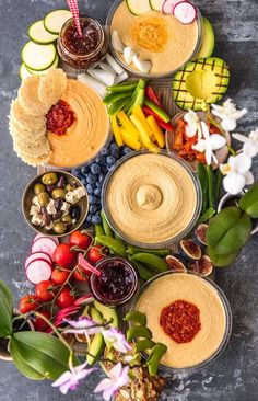 several bowls filled with different types of food on top of a table next to each other