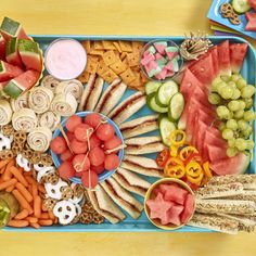 a blue tray filled with lots of different types of food