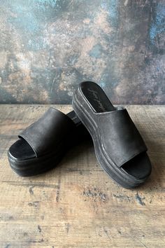 Super comfy Platform slides. I wore these a few times, they are in great condition. A couple small scuffs but can be buffed out! Size 38 Retails at $98 Leather upper with manmade sole.The leather and sole finishes on this vintage-inspired style have been handcrafted to reflect a two-tone wax, burnish finish. Wedge measures approx 2.5" HPlatform measures approx 1.75" H Imported Fits True to Size Platform Slides, Platform Sandals, Handcrafted Jewelry, Two Tone, Slides, Vintage Inspired, Leather Upper, Free People, Wedges