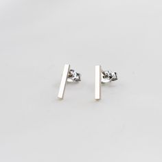 "14K White Gold Bar Earrings. 14K White Gold Simple Earrings. 14K Solid Gold Minimalist Earrings 14K solid white gold bar. It is 1.5mm wide. (Please select the length of bars : 3/8\", 1/2\" 5/8\")  The model in the picture wears 3/8\" bar earrings. 14K solid gold ear wire Please select ear nut (silicone or 14k gold)" Minimalist 14k Rose Gold Linear Earrings, Minimalist 14k Gold Silver Earrings, Silver Minimalist Linear Earrings In 14k Gold, Silver Linear Earrings In 14k Gold, Minimalist Style, Minimalist Yellow Gold Earrings, Minimalist 14k White Gold Earrings, Minimalist Yellow Gold Linear Earrings In Sterling Silver, Minimalist 14k Gold Linear Earrings Gift, Minimalist Yellow Gold Linear Earrings