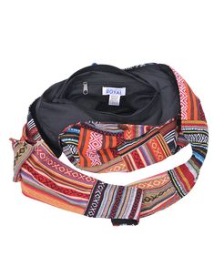 Tote your essentials in boho style with this bold cotton handbag that will add a splash of flash to multiple ensembles. Note: This one-of-a-kind item is handcrafted. Actual colors may be different than shown. Approximate Bag Size: 14" x 3.5" x 13"; Shoulder Strap Length: 22" Lined Interior with side pocket, Top zipper with button fastener 100% Cotton Hand Wash, Hang Dry Made in Nepal Everyday Bohemian Cotton Hobo Bag, Casual Cotton Hobo Bag For Festival, Multicolor Bohemian Shoulder Bag For Travel, Colorful Bohemian Woven Bag, Bohemian Multicolor Cotton Hobo Bag, Bohemian Cotton Bag With Adjustable Strap, Festival Cotton Tote Shoulder Bag, Red Bohemian Cotton Bags, Bohemian Multicolor Cotton Bags