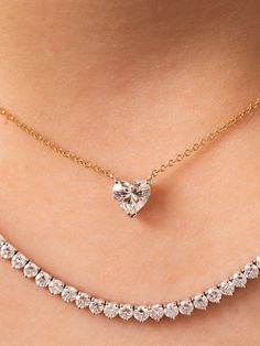 This beautiful diamond heart necklace is made to order. As always, we make a custom low profile basket for the heart diamond to sit in on a delicate 14K gold chain. It is perfect for wearing everyday on its own or layered with another necklace or two. 0.50ctw in stock is a G color SI2 clarity. Other sizes are custom made and can vary in color, clarity and cost. Available in 14K yellow, white or rose gold and the size of diamond vary based on your selection. This product is made to order and take Luxury Heart Cut Necklace With Prong Setting, Luxury Diamond White Heart Cut Diamond Necklace, Luxury Heart Cut Diamond Necklace With Single Cuts, Luxury Heart-shaped Necklace With Prong Setting, Luxury Heart Cut Diamond Necklace With Brilliant Cut, Luxury Heart Cut Brilliant Diamond Necklace, Luxury Heart Shaped Brilliant Cut Diamond Necklace, Luxury Heart Cut Diamond Necklace For Anniversary, Classic Brilliant Cut Heart Shaped Diamond Necklace