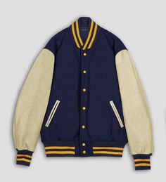 DETAILS OF JACKET The Classic Varsity Jacket Color: Navy Blue / Natural Cream Navy / Gold Rib on Neck, Wrist & Bottom/Hem Two External Side Pockets Exterior Sleeve: Cowhide Leather Interior: Polyester Quilted lining / Two Internal Pockets Style: Classic Varsity Care: DRY CLEAN ONLY We can add custom embroidery, printing, or labels on these jackets as per the customer's demand. Additional charges apply. Blue And Gold Letterman Jacket, Fall Outerwear With Baseball Collar And Button Closure, Fall Varsity Sport Coat With Ribbed Cuffs, Varsity Sport Coat With Ribbed Cuffs For Fall, Winter Outerwear With Button Closure And Baseball Collar, Fall Varsity Outerwear With Button Closure, Varsity Outerwear With Button Closure For Fall, Retro Outerwear With Baseball Collar And Pockets, Fitted Varsity Outerwear With Baseball Collar