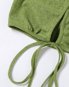 Details: Cropped halter top with waist-line ribbon detailsLength: CroppedSleeve Length: SleevelessMaterials: 95% Cotton + 5% Spandex Solid Halter Neck Tank Top For Vacation, Vacation Halter Neck Tank Top, Green Halter Neck Tank Top For Vacation, Spring Sleeveless Halter Top With Drawstring, Fitted Sleeveless Halter Top With Drawstring, Sleeveless Fitted Tops With Tied Details, Sleeveless Tied Fitted Tops, Fitted Sleeveless Tied Tops, Green Stretch Backless Crop Top