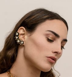 Elevate your earring game with our Handmade 24k Gold Plated Bronze Earcuff Earrings, a stunning pair of wearable art that celebrates indigenous craftsmanship and ethical fashion. These exquisite earcuff earrings feature intricate natural fiber threading from the werregue palm, meticulously incorporated into their captivating design. Each detail reflects the skill and tradition of the indigenous Woounan community in Colombia. Product Details: Material: Crafted with care, these earrings are made f Luxury Yellow Gold Single Ear Cuff, Luxury Brass Clip-on Jewelry, Elegant Yellow Gold Brass Ear Cuff, Luxury Clip-on Brass Jewelry, Gold-plated Ear Cuff With Matching Earrings, Yellow Gold Brass Ear Cuff For Pierced Ears, Yellow Gold Brass Ear Cuff, Elegant Pierced Brass Ear Cuff, Unique Gold Pierced Ear Climbers