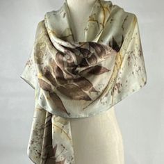 Elevate your style with my exquisite silk satin scarf, a masterpiece of nature-inspired art and unparalleled craftsmanship. Each piece is hand-dyed and eco-printed, ensuring a unique and sustainable accessory that embodies the beauty of the natural world.  Gray with a hint of light this accessory is perfect as a scarf or shawl.  It will add a touch of sophistication to any outfit, whether casual or formal!

Wrap yourself in elegance and make every moment special with a scarf that reflects your style and values. Embrace the fusion of art and nature with our luxurious hand-dyed eco-printed scarf. Order yours today and experience the difference of truly unique, handcrafted fashion.

Light weight, this scarf is approximately 22" x 88"

I so appreciate your support! Cassia Fistula, Eco Print Scarf, Formal Wrap, Hand Dyed Scarves, Hand Dyed Silk Scarf, Green Silk Scarf, Silk Stoles, Large Silk Scarf, Eco Print