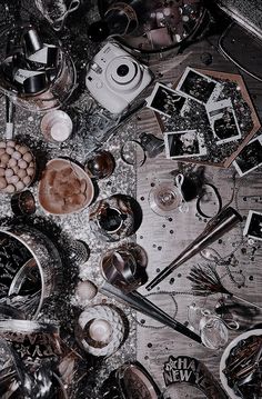 a table topped with lots of plates and cups