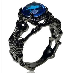 Available Ring Sizes: 6, 8 Material: Crystal And Zinc Bundle And Save. All Jewelry Is Buy One Get One Half Off. Message Me To Create Your Bundle. Shameless Sales Pitch: Do You Like Skeletons? Well He're 2 Black Colored Skeletons Holding Up A Beautiful Blue Gem. What Could Be A More Beautiful Combination. Black And Blue Themed Wedding, Pirate Witch, Goth Engagement Rings, Witch Oc, Gothic Jewelry Rings, Blue Skeleton, Satanic Jewelry, Mha Dr, Blue Engagement Ring