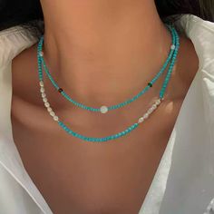 This delicate necklace brings together the serenity of turquoise beads with the subtle shimmer of moonstone. Each piece is meticulously crafted with natural freshwater pearls and blue turquoise accents, offering a unique combination of textures and colors. The adjustable chain ensures a comfortable fit, making this necklace perfect for layering or wearing on its own for a minimalist, chic look. Details Material: 24K gold-plated brass, natural freshwater pearls, turquoise, and moonstone Length: 46cm, 47cm, 46cm (with 5.5cm extension) Weight: Approx. 5.3g, 7.0g, 8.0g Style: Elegant and versatile, perfect for both casual and formal occasions Care Tips: Avoid exposure to harsh chemicals and keep dry to maintain its beauty Missy Jewelry Natural Stone Necklace Collection Turquoise Jewelry With Pearl Chain And Round Beads, Bohemian Blue Necklace With Pearl Chain, Blue Bohemian Pearl Necklaces, Blue Bohemian Pearl Necklace, Bohemian Blue Pearl Jewelry, Turquoise Beaded Necklaces With Pearl Chain As Gift, Turquoise Necklaces With Pearl Chain And Round Beads, Turquoise Necklace With Round Pearl Beads, Turquoise Necklace With Pearl Chain And Round Beads