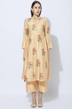 Peach kurta with all-over floral motif work. Comes with plain inner and straight pants.
Components: 3
Fabric: Silk, Cotton, Kota
Neckline: Round
Sleeve Length: Three Quarter
Color: Peach
Hand Paint
Buttoned placket
Side gathers
lace trim sleeve hem
Closure:
Pants: Front zip - Aza Fashions Kurta Set For Women, Kurta Set, Indian Design, Straight Pants, Set For Women, Traditional Dresses, Aza Fashion, Floral Motif, Three Quarter